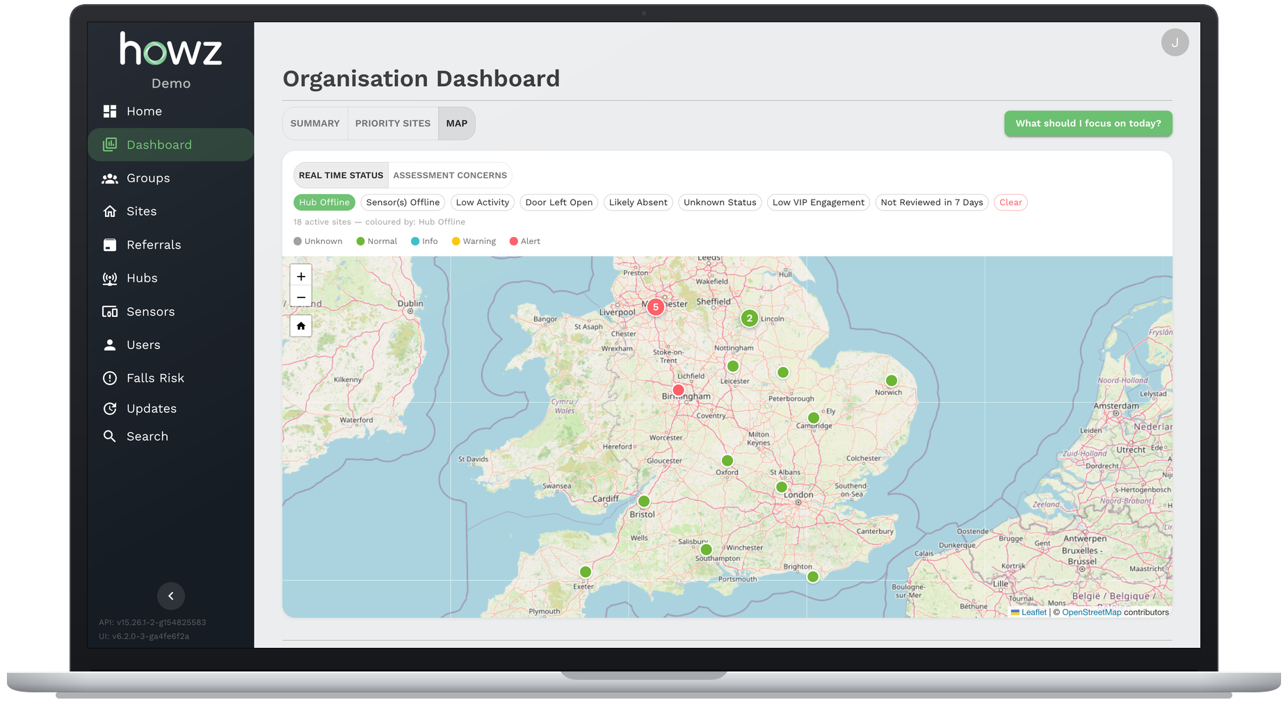 The Howz care portal organisation dashboard on a laptop, showing a map of England with each home coloured by its real time status